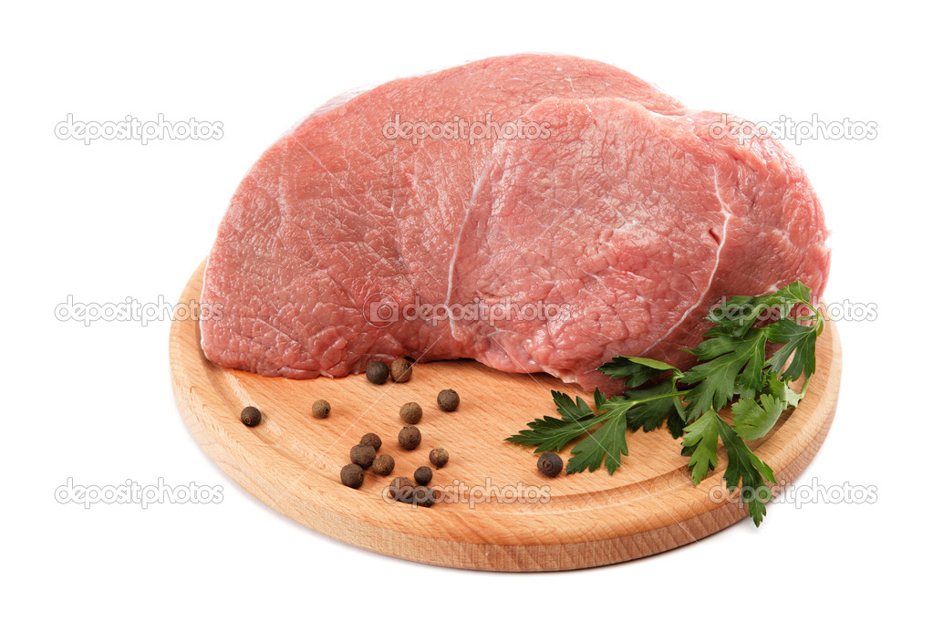 Raw meat on a wooden cutting board isolated on white background.