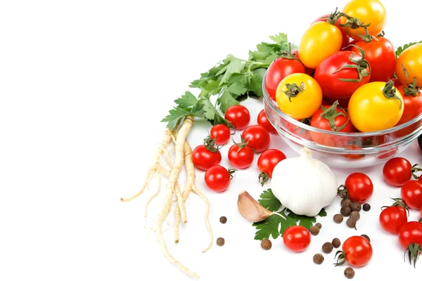 Tomatoes in a glass plate, garlic and parsley isolated on white — Stock Photo, Image