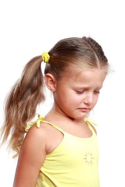 Portrait of a sad sweet little girl isolated on white background — Stock Photo, Image