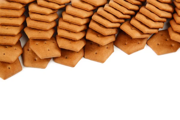 Stack of cracker biscuits on a white background. — Stock Photo, Image