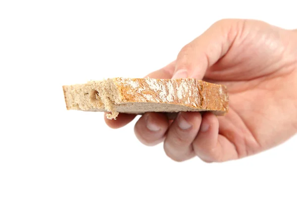 Bröd slice i hand på vit bakgrund. — Stockfoto