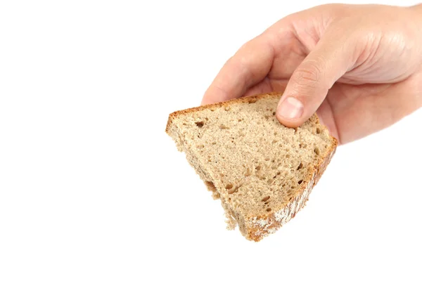 Rebanada de pan en la mano sobre fondo blanco . —  Fotos de Stock