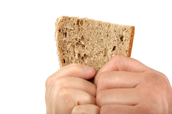 Bröd slice i händerna på vit bakgrund. — Stockfoto