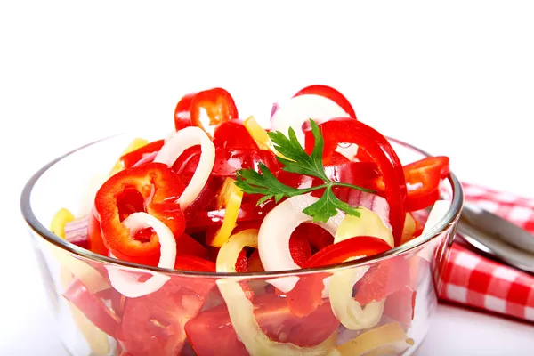 Fresh vegetable salad in a glass dish on a white background. — Stock Photo, Image