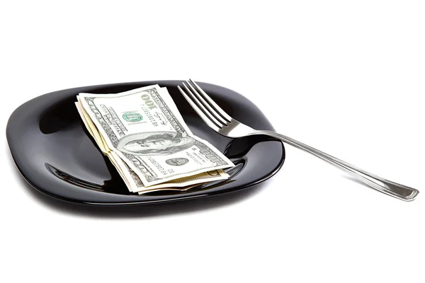 Billetes en un plato negro y tenedor . —  Fotos de Stock