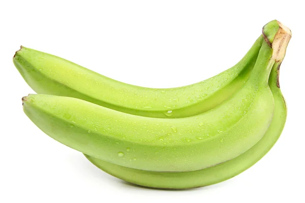 Bananas verdes ramificadas en gotas de agua . — Foto de Stock