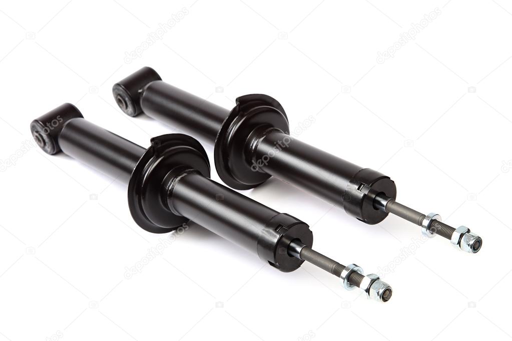Two car shock absorber on white background.