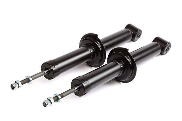 Two car shock absorber on white background.