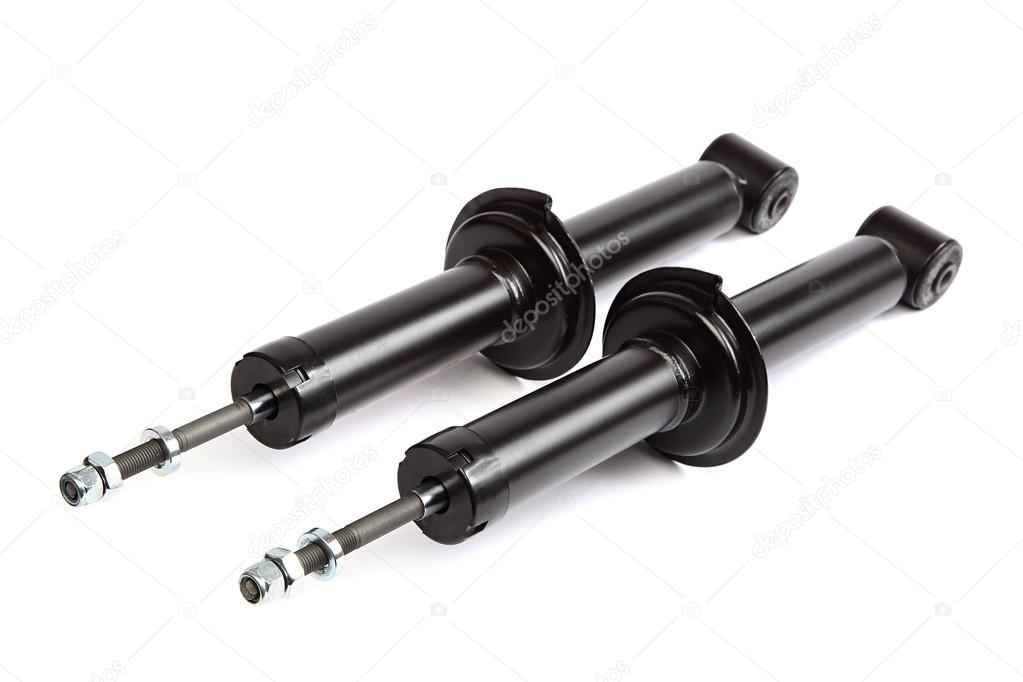 Two car shock absorber on white background.