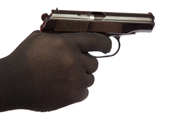 Pistolet à la main avec gants noirs . — Photo