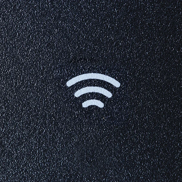 Wireless sign on dark Plastic background — Stock Photo, Image