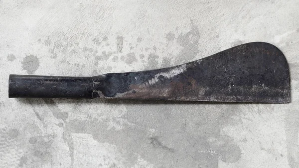 Old big knife on concrete — Stock Photo, Image