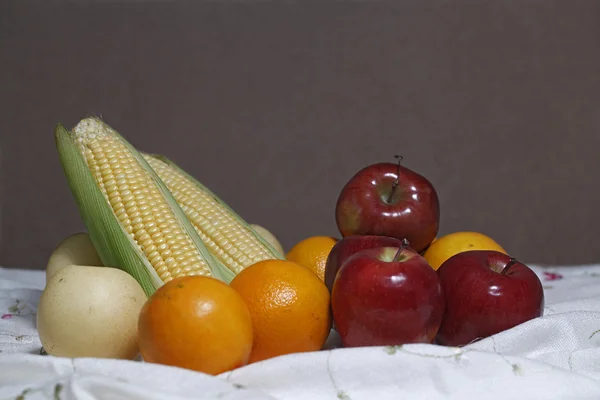 Organic fruits on wooden background (Still life) — Stock Photo, Image