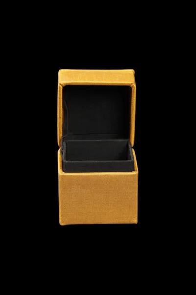 Yellow silk box on dark background — Stock Photo, Image