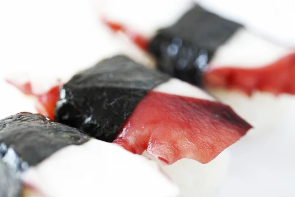 Selektivní pozornost detailním Trojitá tako sushi izolovaných na bílém zpět — Stock fotografie