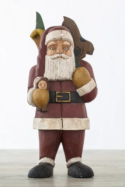 Antieke houten santa op houten tafel — Stockfoto