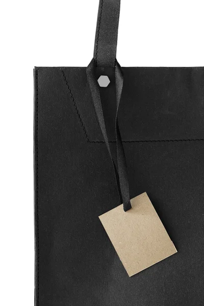 Paper tag on black paper — Stock Photo, Image