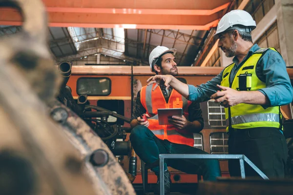 industrial factory with men at work concept, professional engineers foreman inspectors talking in business occupation job teamwork with team, construction managers working in manufacturing technology job