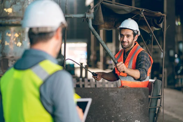 industrial factory with men at work concept, professional engineers foreman inspectors talking in business occupation job teamwork with team, construction managers working in manufacturing technology job