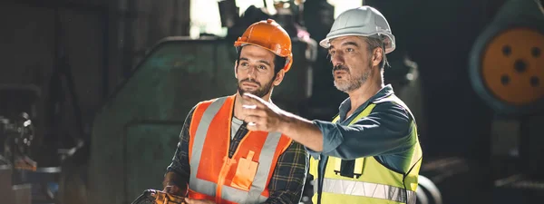 industrial factory with men at work concept, professional engineers foreman inspectors talking in business occupation job teamwork with team, construction managers working in manufacturing technology job