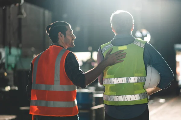 industrial factory with men at work concept, professional engineers foreman inspectors talking in business occupation job teamwork with team, construction managers working in manufacturing technology job