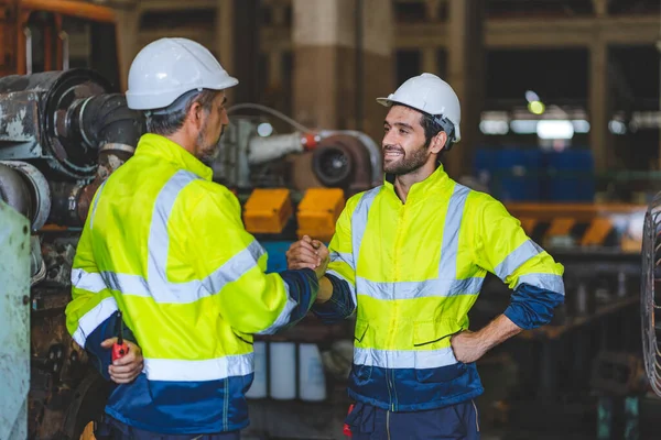 industrial factory with men at work concept, professional engineers foreman inspectors talking in business occupation job teamwork with team, construction managers working in manufacturing technology job