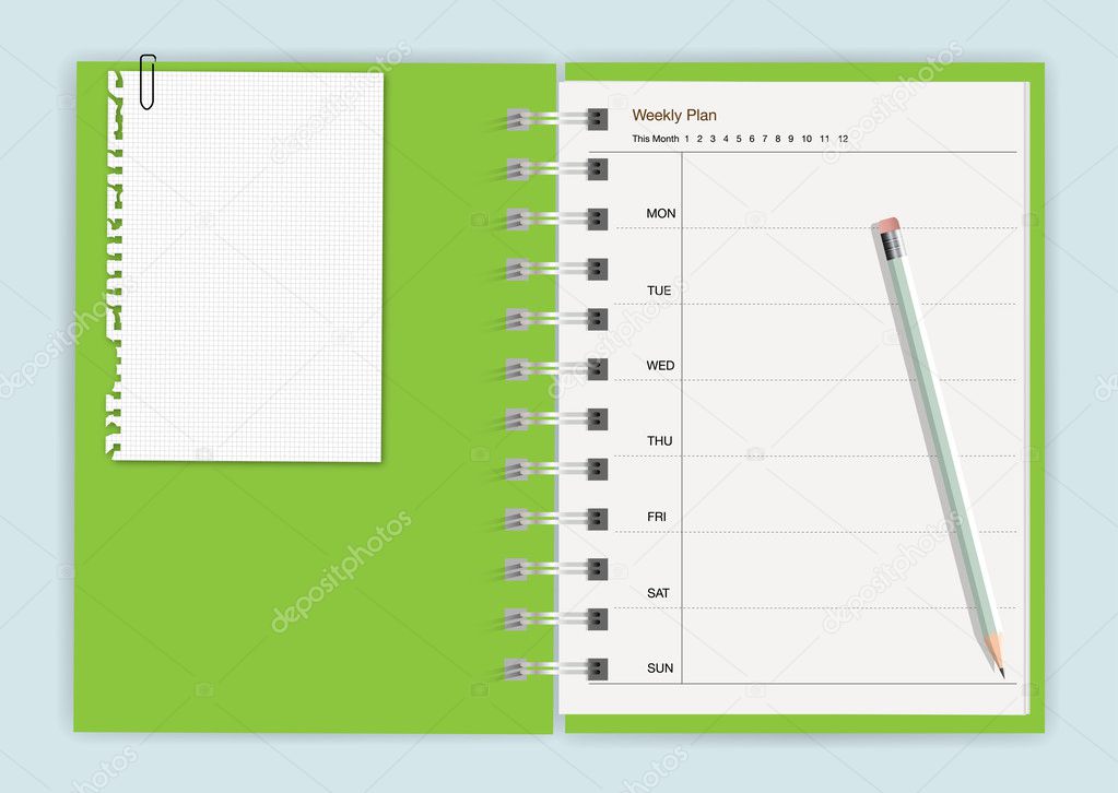 Green notebook with pencil