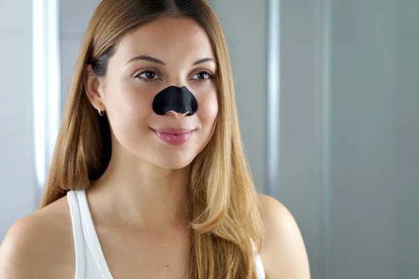 Beautiful Young Woman Black Charcoal Nose Strip Looking Mirror Home — ストック写真