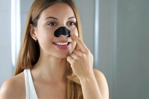 Beauty Smiling Girl Applying Satisfied Black Charcoal Nose Strip Looking — Foto de Stock