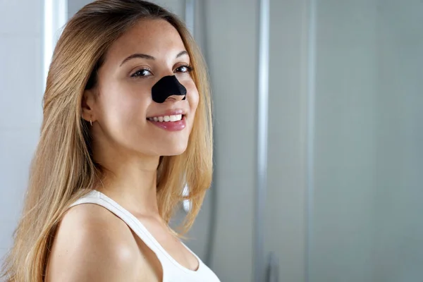 Attractive Young Woman Black Charcoal Nose Strip Looking Mirror Home — ストック写真