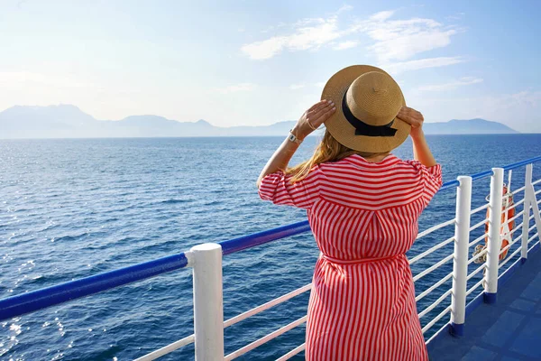 Cruise ship vacation holiday. Back view of stylish girl traveling on cruise liner. Copy space.