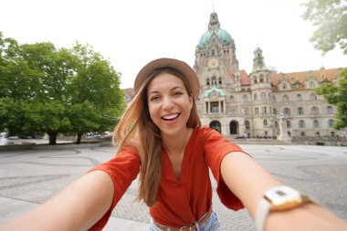 Beautiful excited school exchange girl takes self portrait in Hanover, Germany