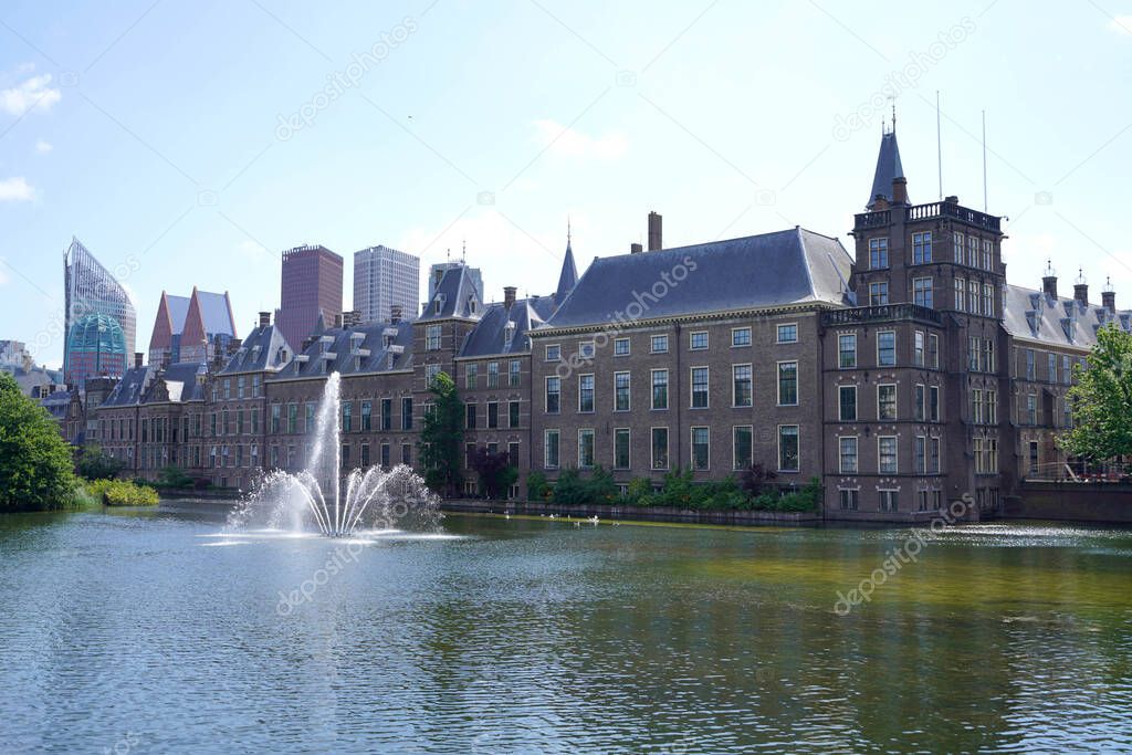 Panoramic landscape view with Binnenhof parliament building on Hofvijver pond, The Hague, The Netherlands