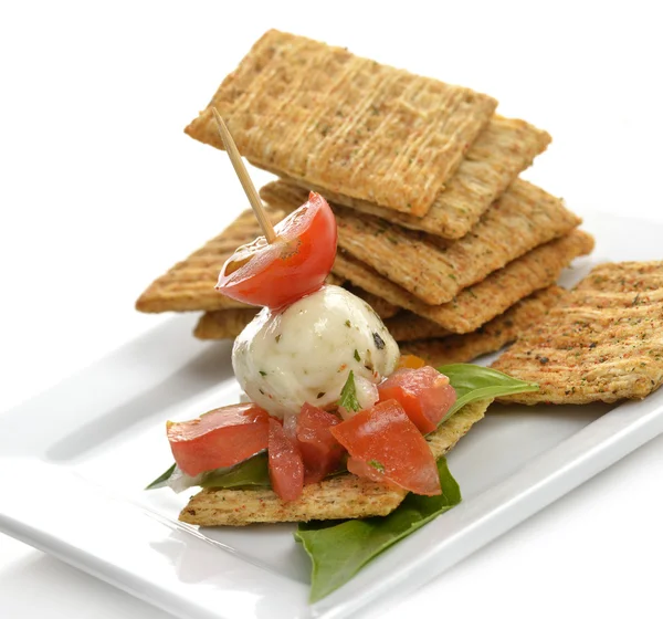 Crackers With Mozzarella And Tomatoes — Stock Photo, Image