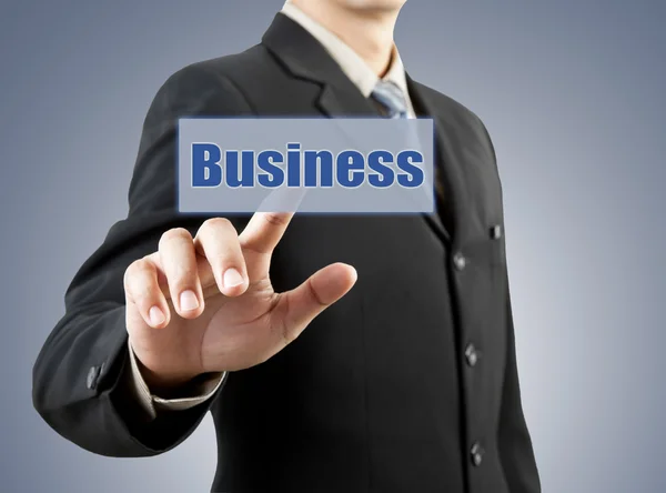 Businessman hand pushing business button — Stock Photo, Image