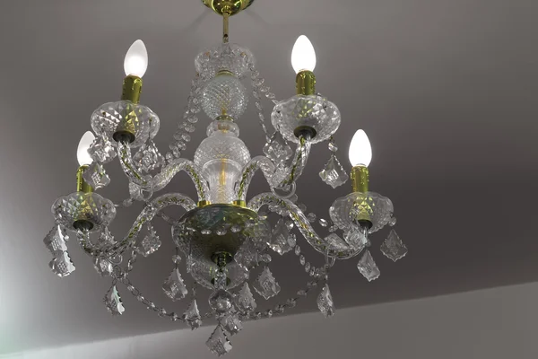 Crystal chandelier on ceiling — Stock Photo, Image