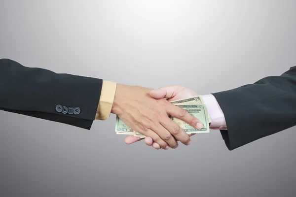 Businessman hand and money to other for corruption concept — Stock Photo, Image