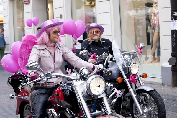 WARSAW, POLAND, September 8: Unidentified woman on the motorcycle on the 15th Pink Ribbon Walk against the Breast Cancer september 8, 2012 in Warsaw, Poland. — Stock Photo, Image