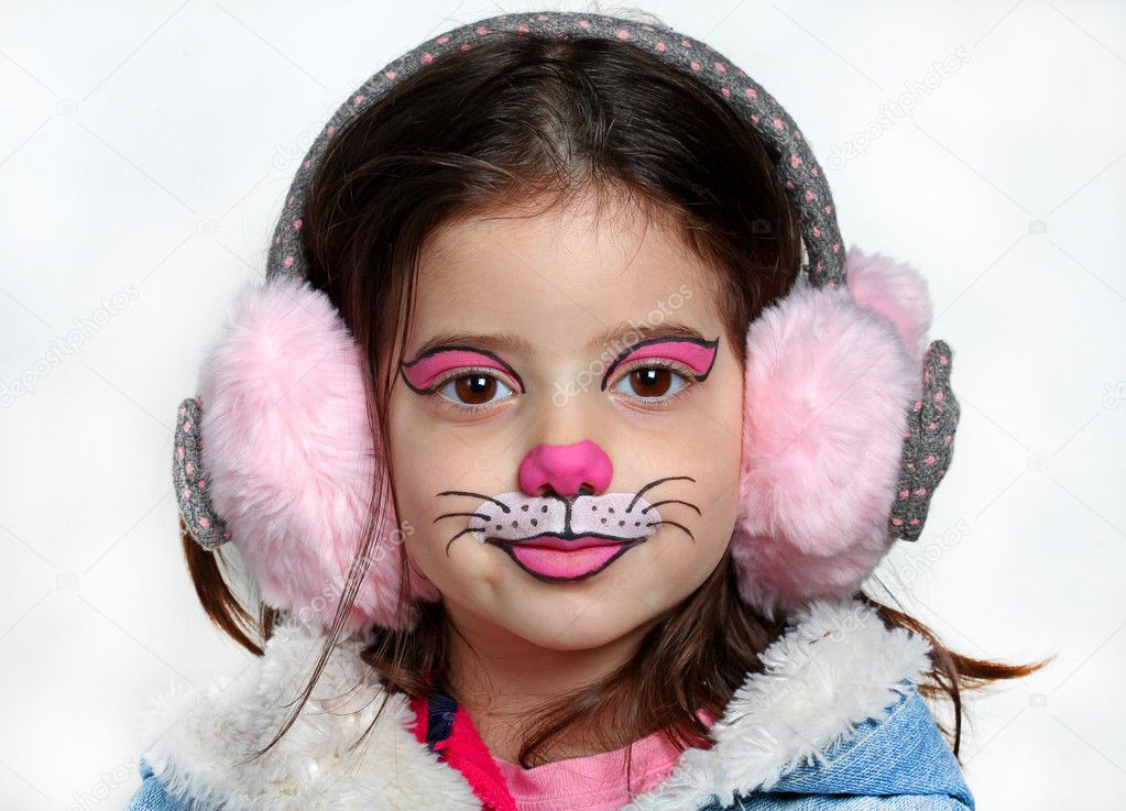 Pretty girl with face painting of a cat