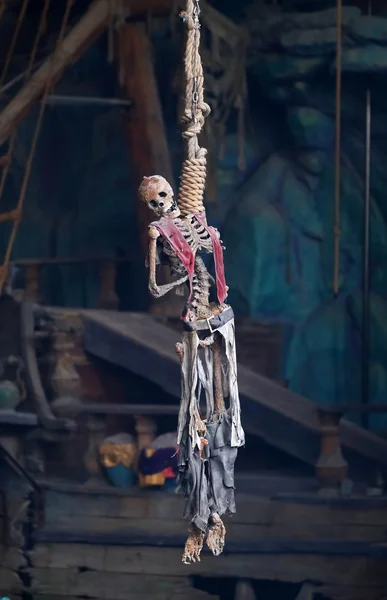 A pirate skeleton hanging from a noose
