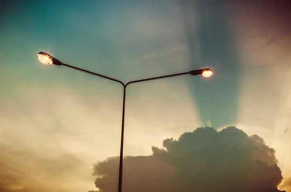 Cloud light sky and light pole vintage color — Stock Photo, Image