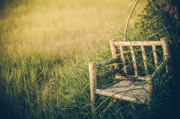 Bamboo wooden chairs on grass vintage — Stock Photo, Image