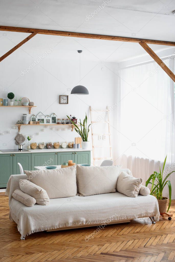 Living room and kitchen close-up. White plaid. Parquet floor. Scandinavian cozy style.