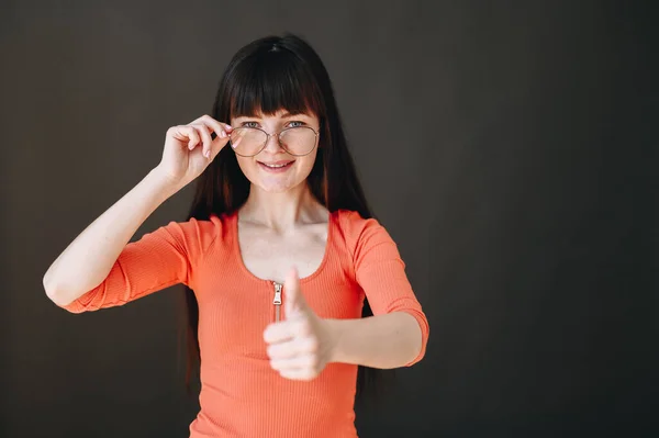Young Woman Dark Hair Glasses Showing Thumb Isolated Background Photo — Φωτογραφία Αρχείου