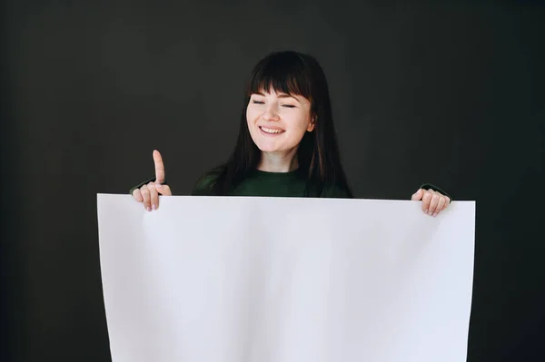 Horizontal Photo Girl Who Holds Drawing Paper Her Hands Points — Φωτογραφία Αρχείου
