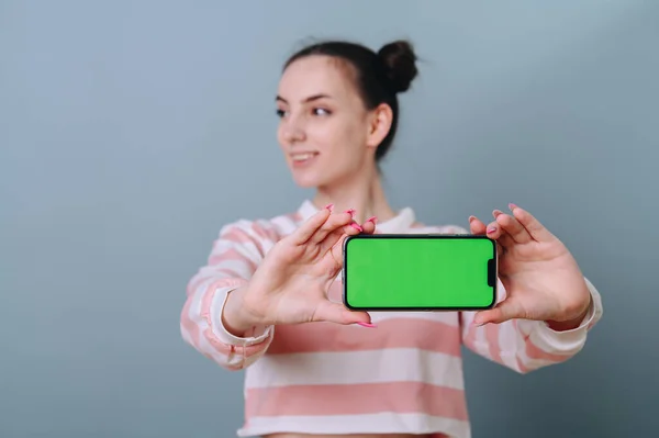 Portrait Caucasian Woman Showing Presenting Mobile Phone App Hand Isolated — Φωτογραφία Αρχείου