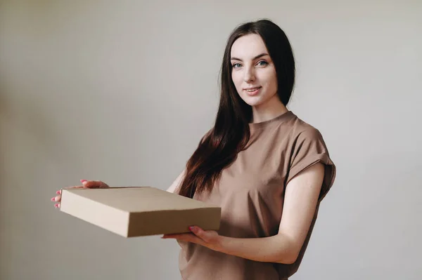 Portrait of her she nice cute lovely pretty beautiful cheerful dreamy lady holding in hands carton pizza box smelling isolated over background