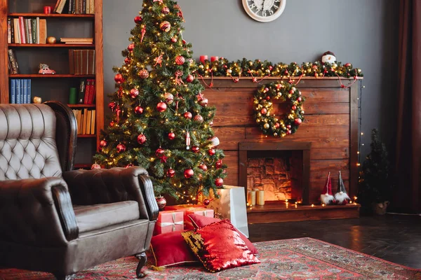 English Brown Armchair Against Backdrop of Christmas tree and Fireplace. New Year's Eve Decor. Warm red-brown Interior