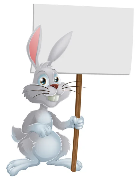 Paskalya tavşanı işaret tutan beyaz — Stok Vektör