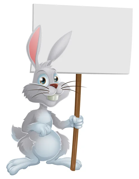 White Easter bunny holding sign — Stock Vector